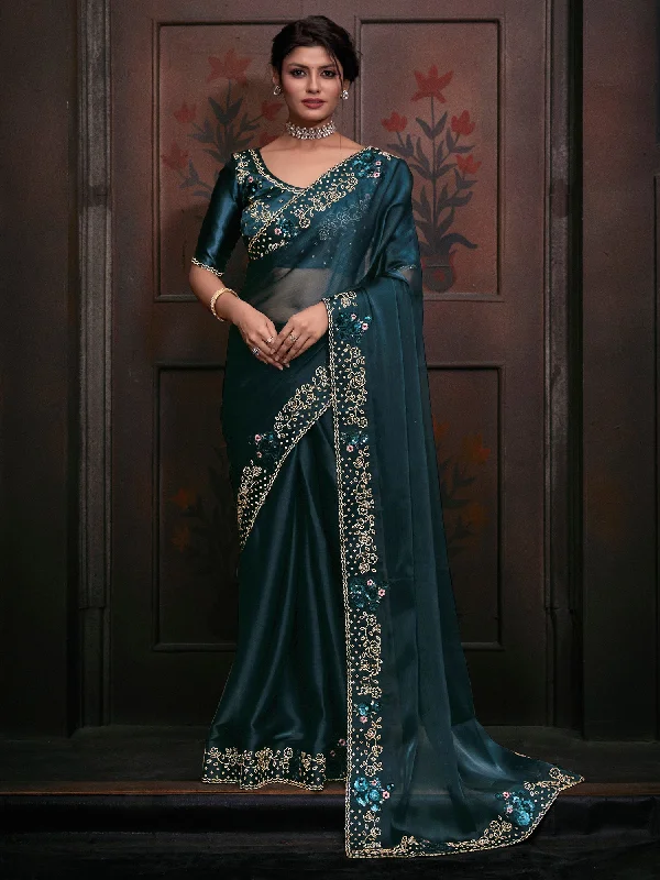 Women's Organza Teal blue Embellished Designer Saree With Blouse Piece Airy Cotton Blouse Women's Organza Teal blue Embellished Designer Saree With Blouse Piece Airy Cotton Blouse